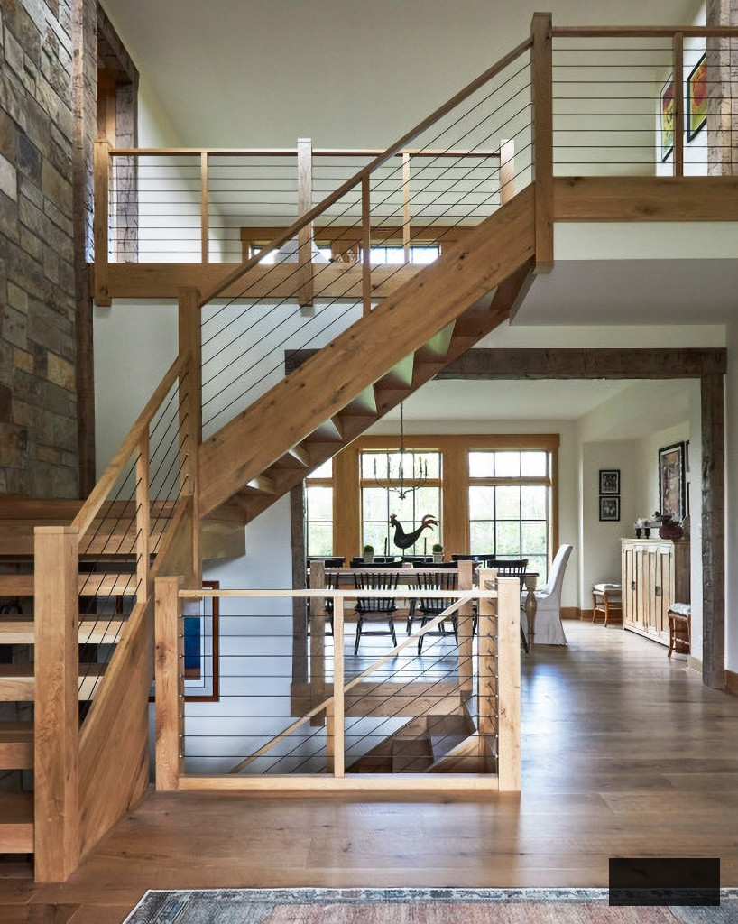 open rustic staircase in charming country estate