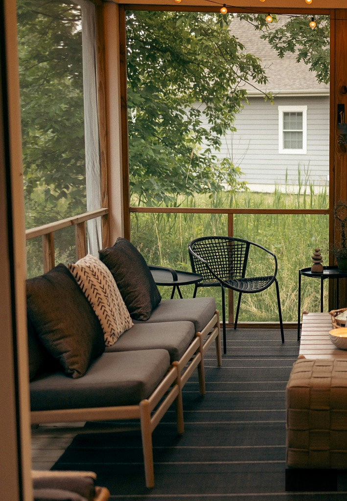 screened porch in farmhouse-style bungalow