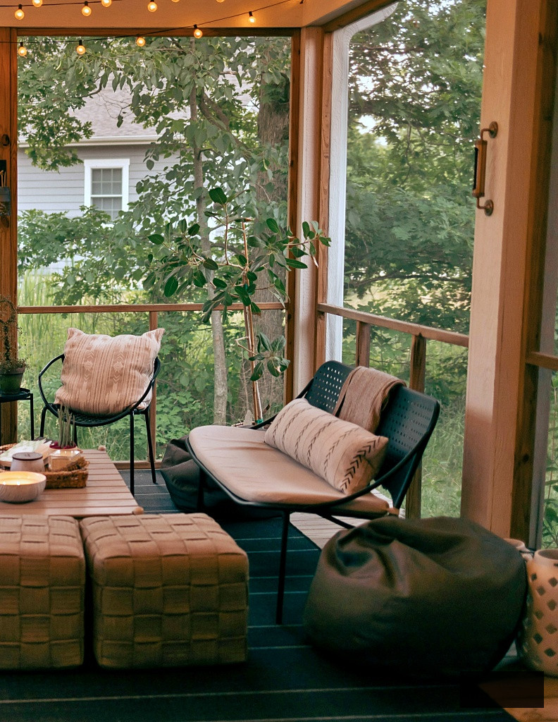 screened porch in farmhouse-style bungalow