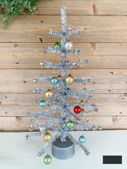 Learn how to create a DIY Vintage Aluminum Christmas Tree with cost-efficient materials. A delightful retro endeavor to infuse sparkle and vintage allure into your holiday season.