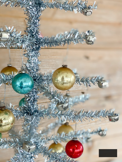 Learn how to create a DIY Vintage Aluminum Christmas Tree with cost-efficient materials. A delightful retro endeavor to infuse sparkle and vintage allure into your holiday season.