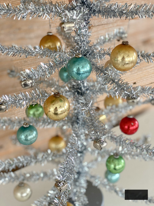 Learn how to create a DIY Vintage Aluminum Christmas Tree with cost-efficient materials. A delightful retro endeavor to infuse sparkle and vintage allure into your holiday season.