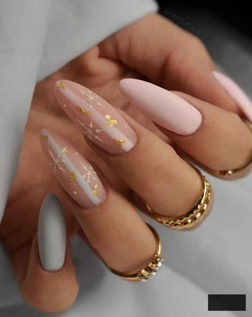 blush pink and gold long almond christmas nails