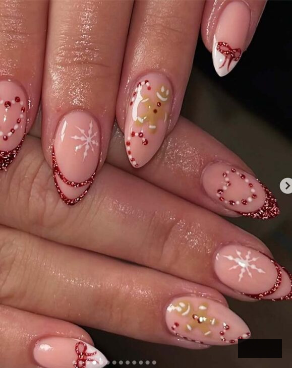 glittery tips on nude base red and white christmas nails with gingerbread cookie