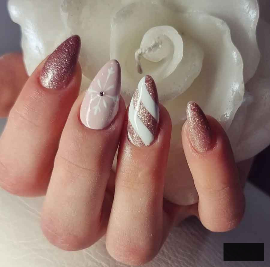 rose gold and white snowflake flitter almond christmas nails
