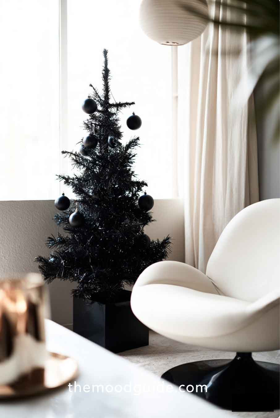 small all black modern minimal chic christmas tree with geometric collar