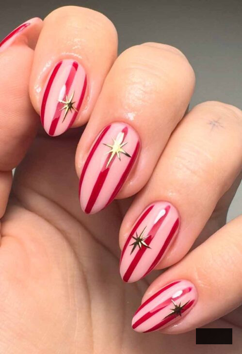 aesthetic striped fuchsia and scarlet nails with gold star