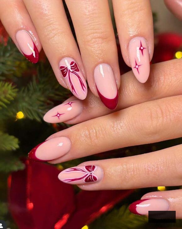 aesthetic burgundy with pink coquette Christmas nail design