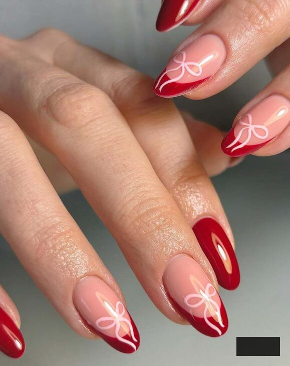 minimalistic scarlet nails with fuchsia bows for Christmas