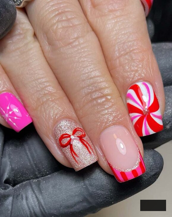 stylish pink, crimson, and golden christmas nails
