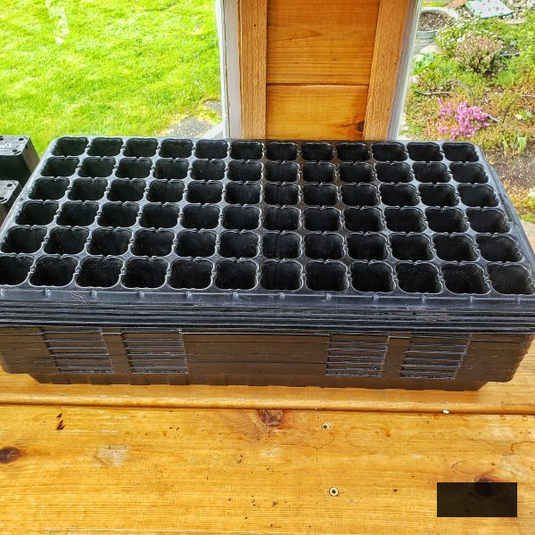 stack of 72 cell trays in the greenhouse