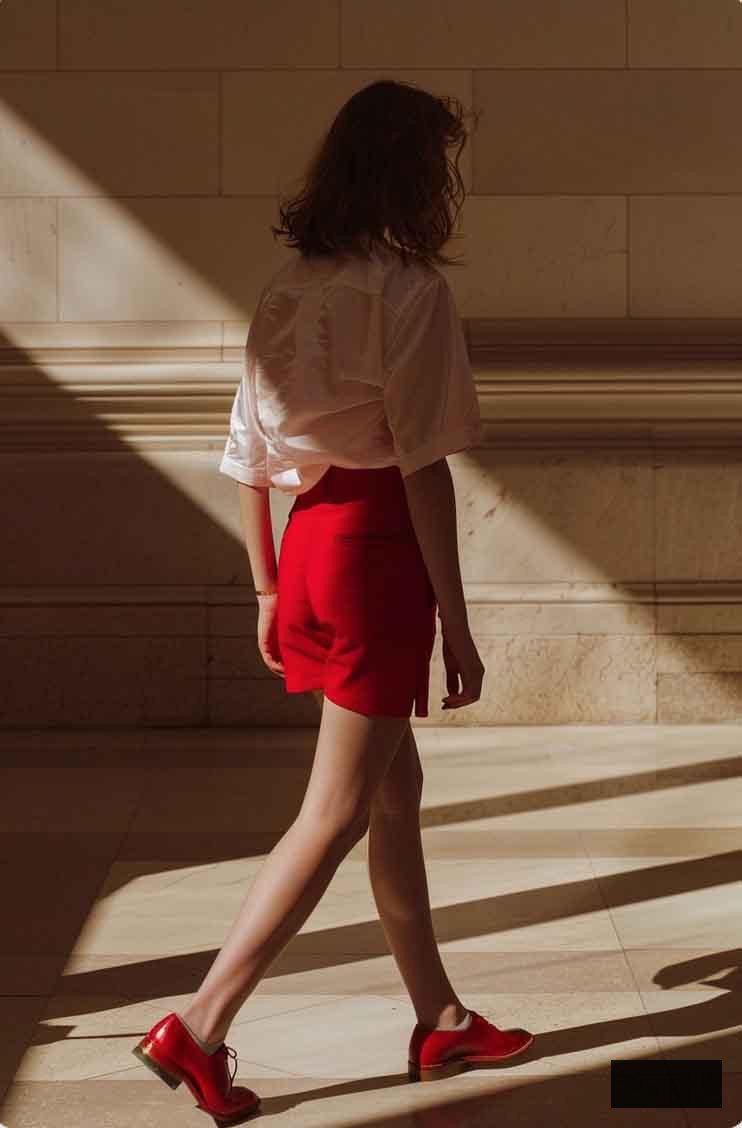 red wide large shorts with red oxfords and white blouse for european summer outfit in elegant and classic old money and light academia aesthetics
