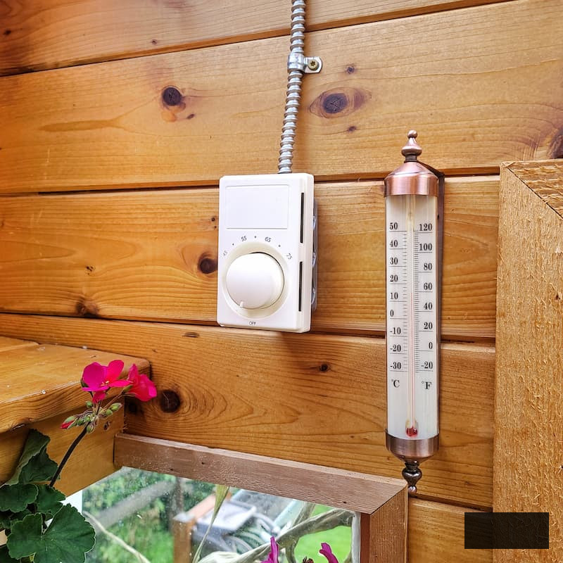 thermostat and thermometer in the greenhouse