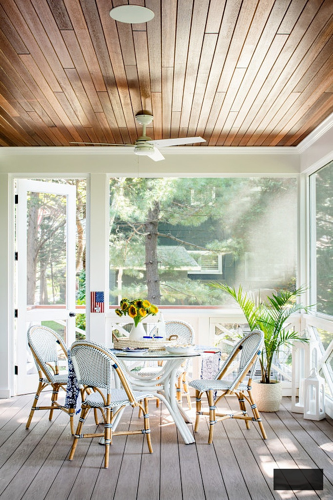 screened in porch on dark green cottage