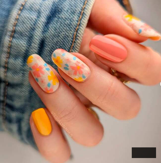 long oval nails with coral and yellow sprig flower nail design