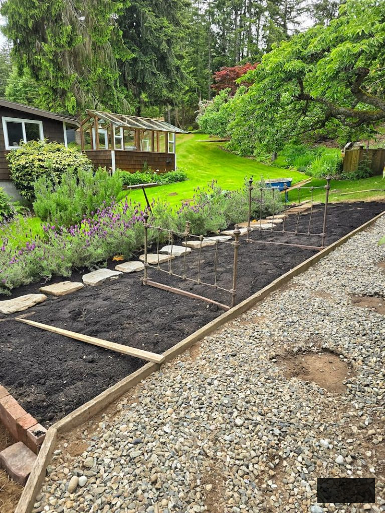 empty garden beds with fresh soil