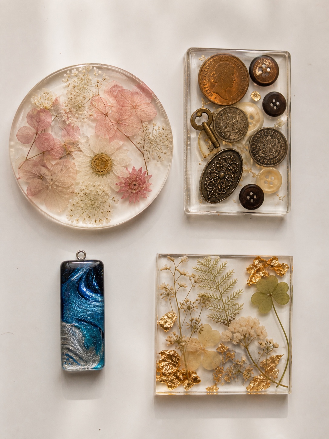 Completed resin inclusion examples Completed resin items featuring embedded flora, coins, buttons, mica patterns, botanicals, and gold leaf. | Sky Rye Design Completed resin items featuring embedded flora, coins, buttons, mica patterns, botanicals, and gold leaf.