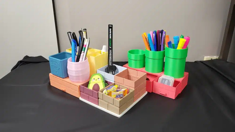 3D printed desk organizer holding pens, markers, and office supplies in different compartments