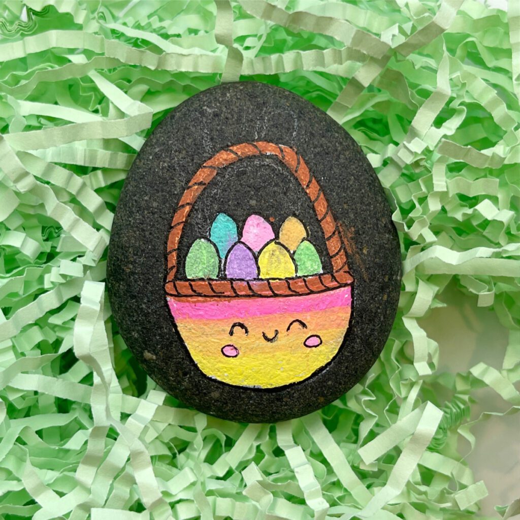 Pedra pintada de cesta da Páscoa