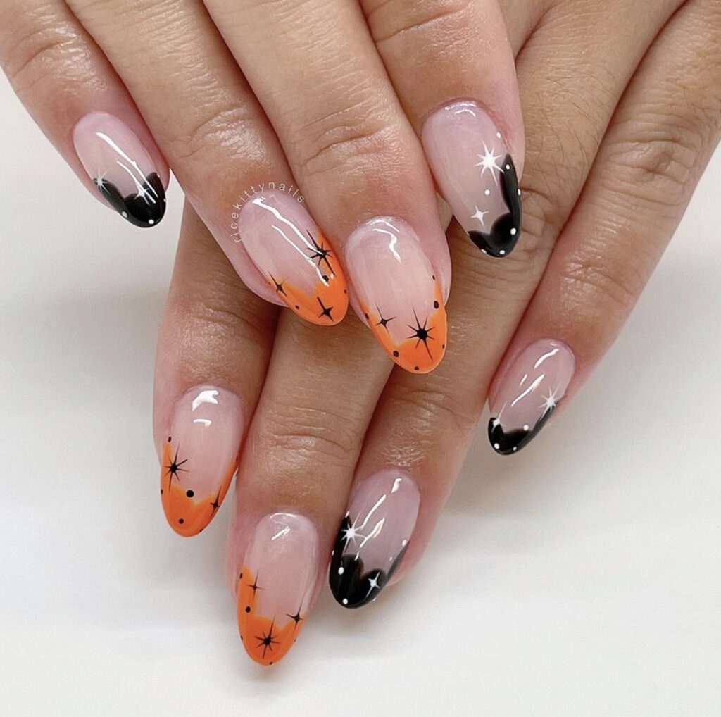 Unhas estilo francesa laranja e preta