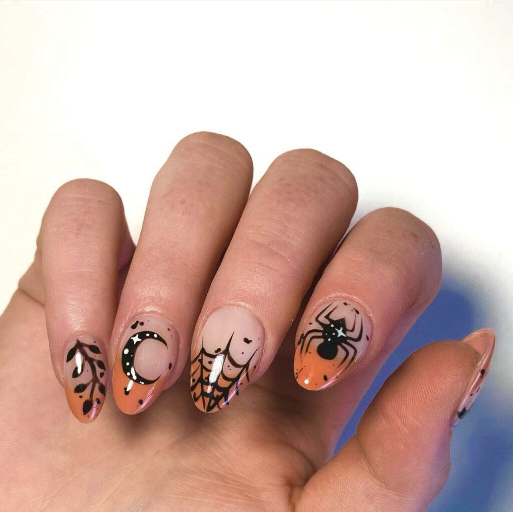 Unhas laranja e pretas