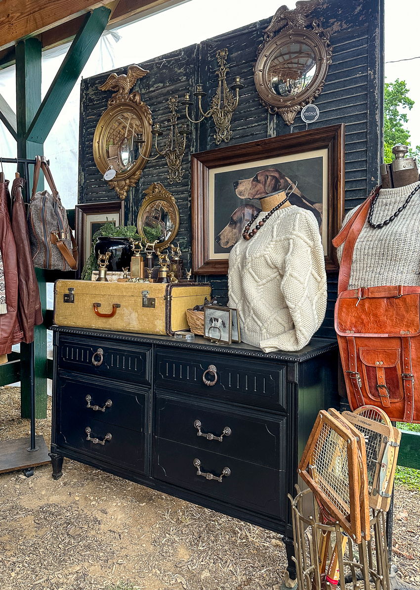Explore my vintage booth from the Lucketts Spring Market. It's among the trendiest vintage markets on the East Coast! #vintage #vintagedecor dark painted dresser, vintage showcase, federal mirrors