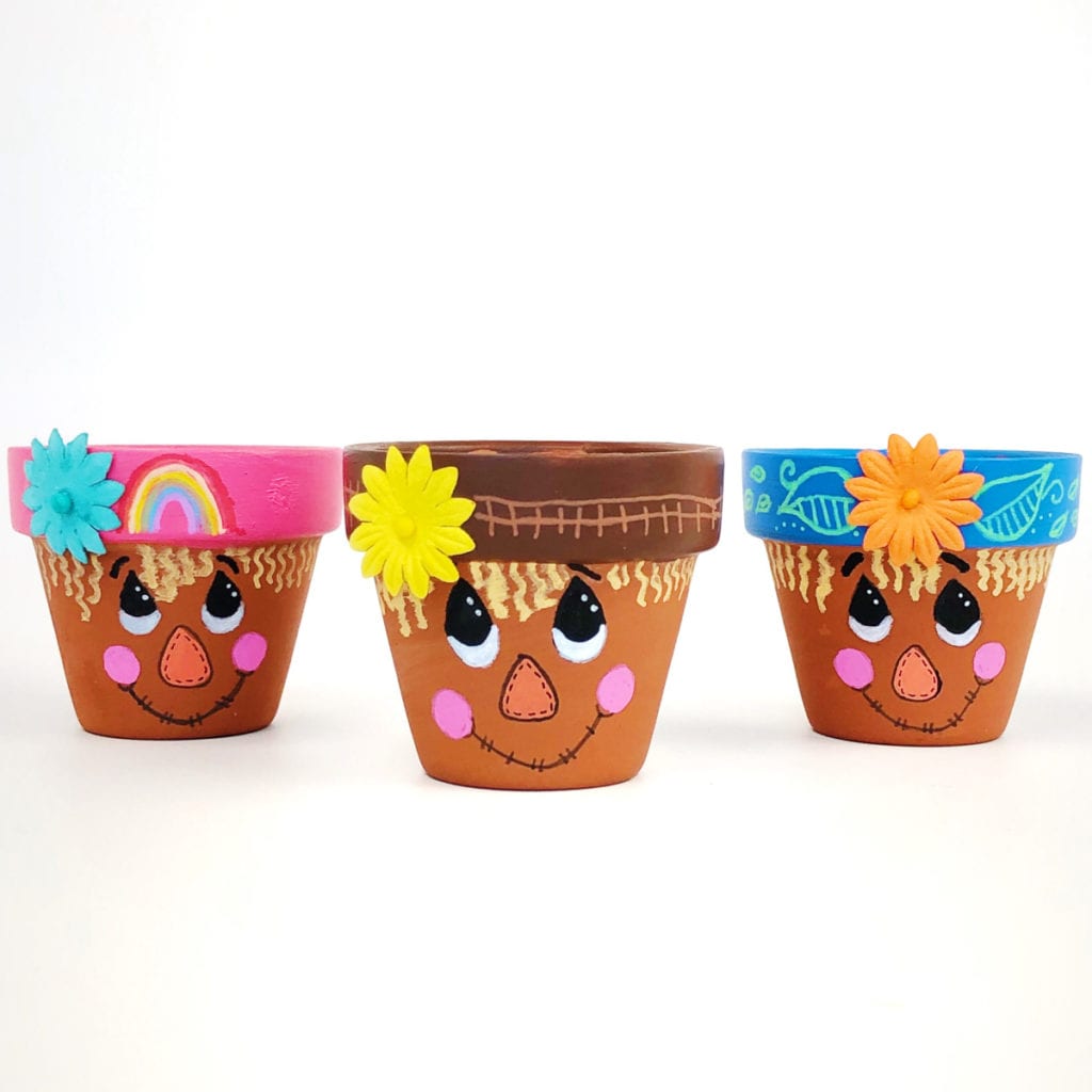 Artesanato de vaso de flores espantalho