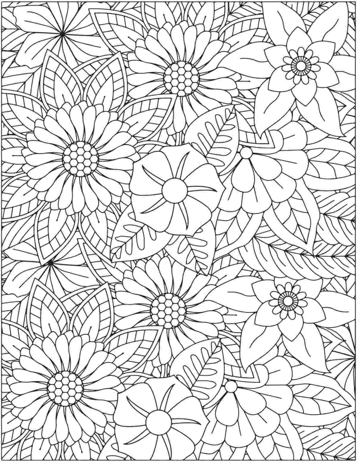 Uma página grátis para colorir de flores para imprimir totalmente preenchida com cabeças de flores de diversos tipos, incluindo narcisos, margaridas e papoulas.